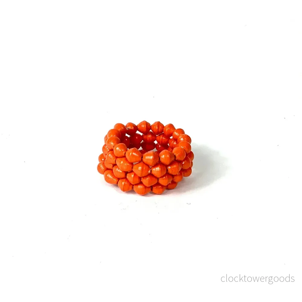 KAZURI "Orange Spiral" Armband