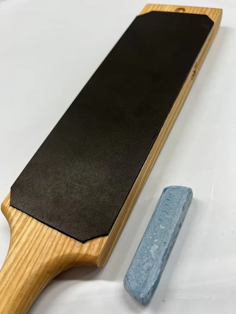 Dubbelsidig läderstrigel 230 × 80 mm på askträ, inkl. slippasta LS1P1